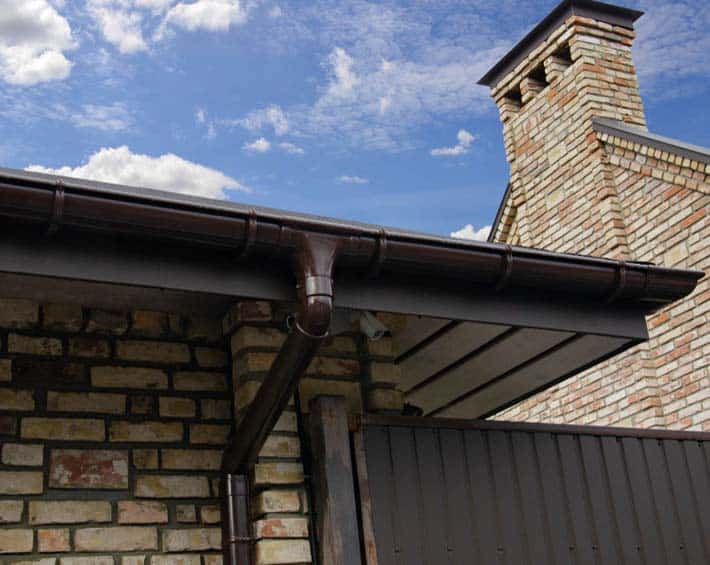 High-quality gutter system installed to protect brick home from water damage and improve drainage.