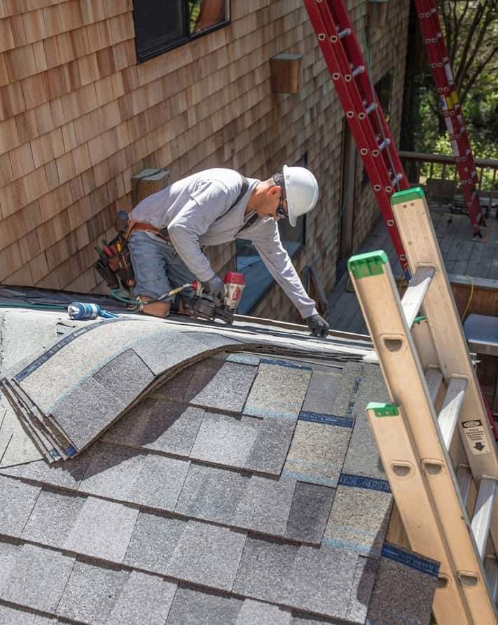 BlueSky roofing crew on a residential roof performing roof replacement in New Jersey