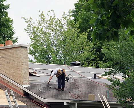 BlueSky roofing crew performing roof repair on a residential home in New Jersey