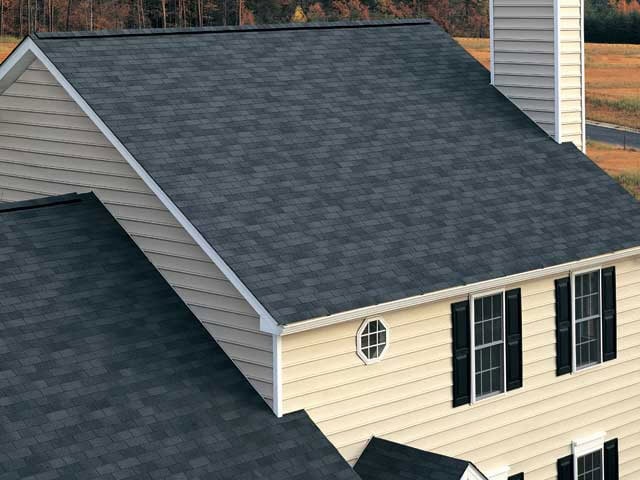 Completed asphalt shingle roof replacement on residential home with durable weather-resistant roofing materials.