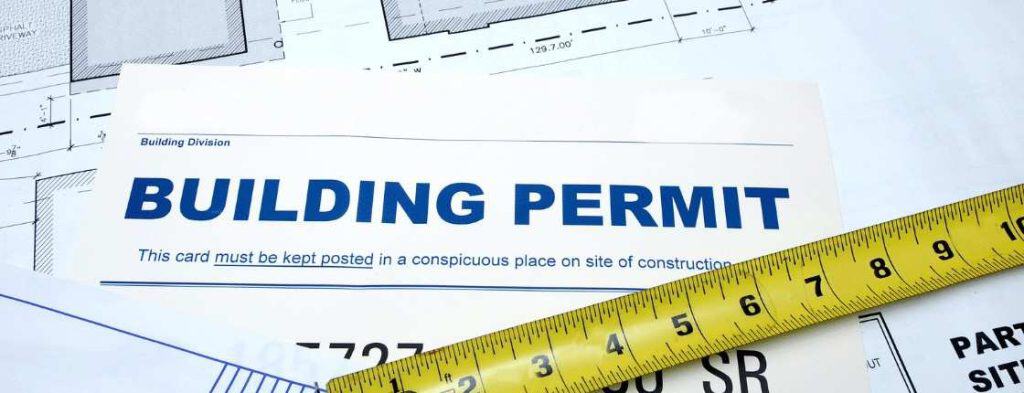 Building permit for roof replacement with measuring tape in New Jersey