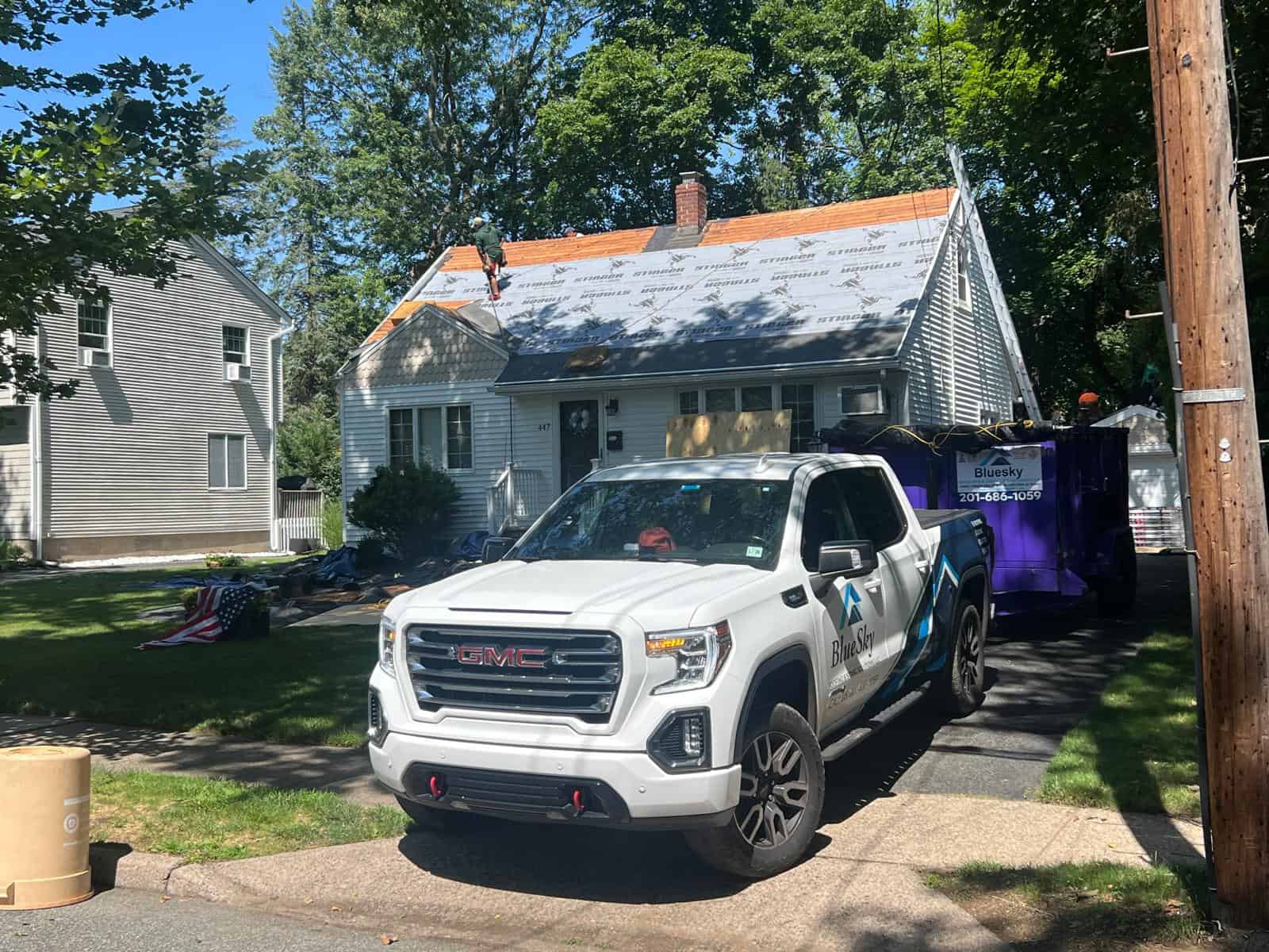 BlueSky roofing crew performing roof replacement on a New Jersey home.