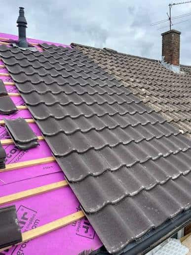 Tile roof replacement in progress on a Morristown, NJ home with new underlayment and roofing tiles being installed.